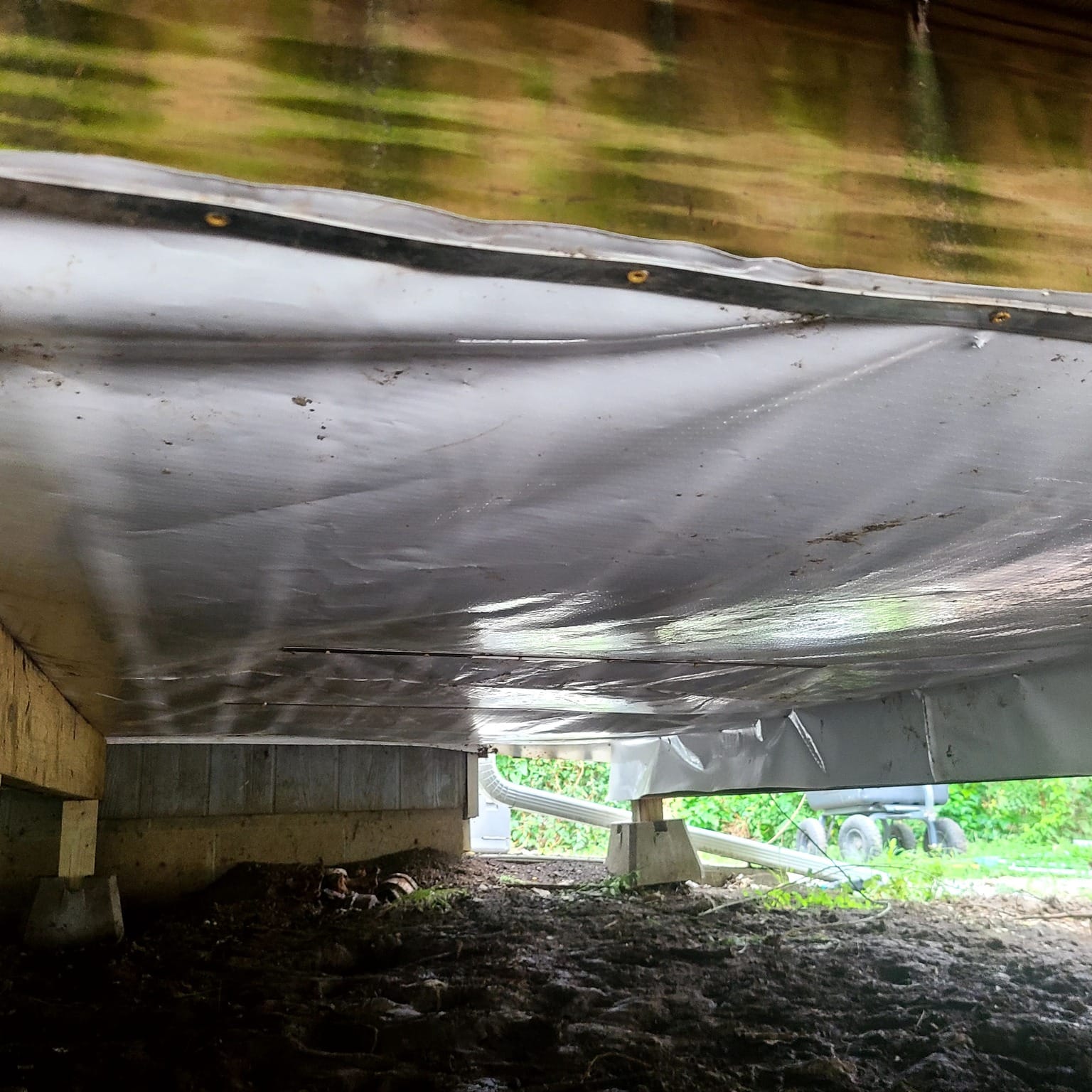 Crawlspace encapsulated with a clean white vapor barrier